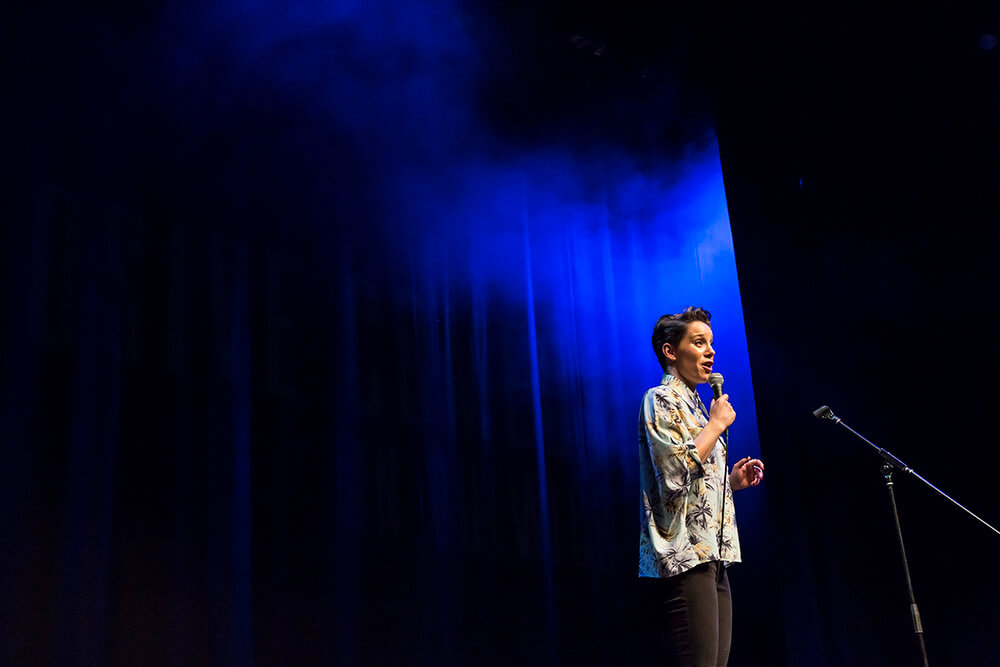 Suzi Ruffell at Big Belly Comedy Club A woman speaking into a microphone on stage.