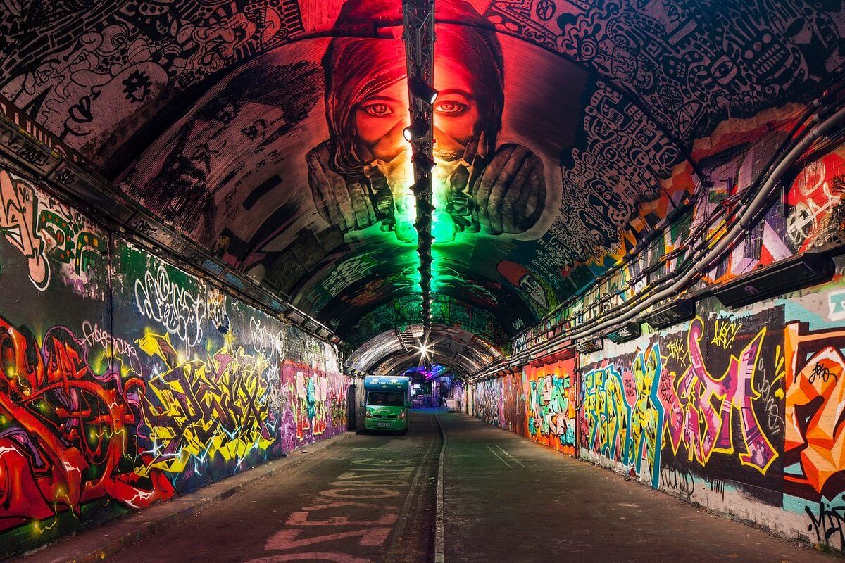 Graffiti-covered tunnel.