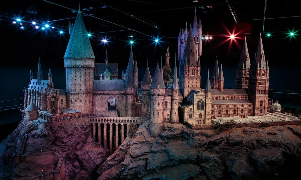 A model of hogwarts castle is on display in a museum.
