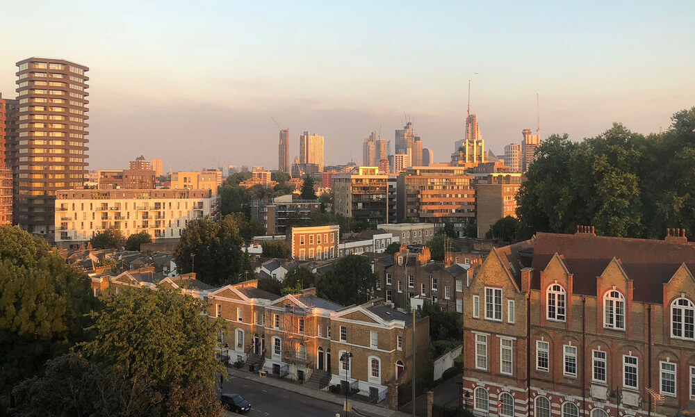 A view of the city of london at sunset.