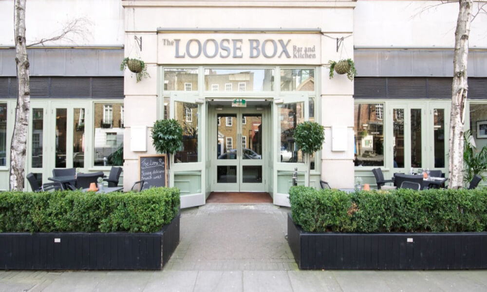 The entrance to the loose box restaurant in london.