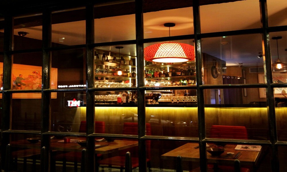 A view of a restaurant through a window.