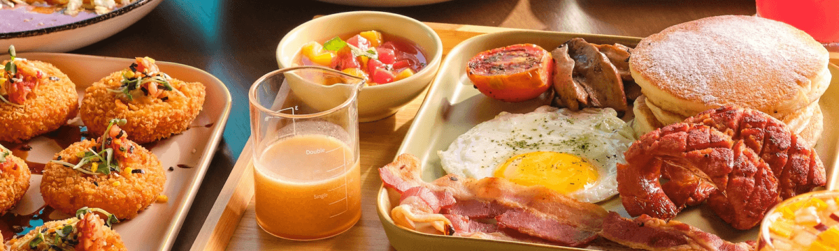 A tray of breakfast food on a table.