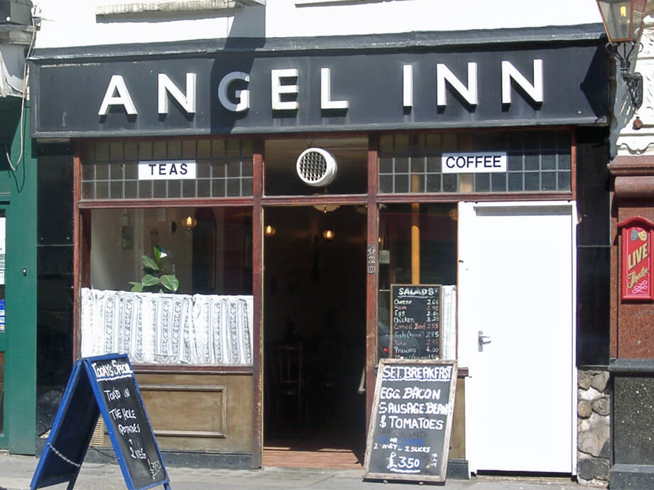 A building with a sign that says angel inn.