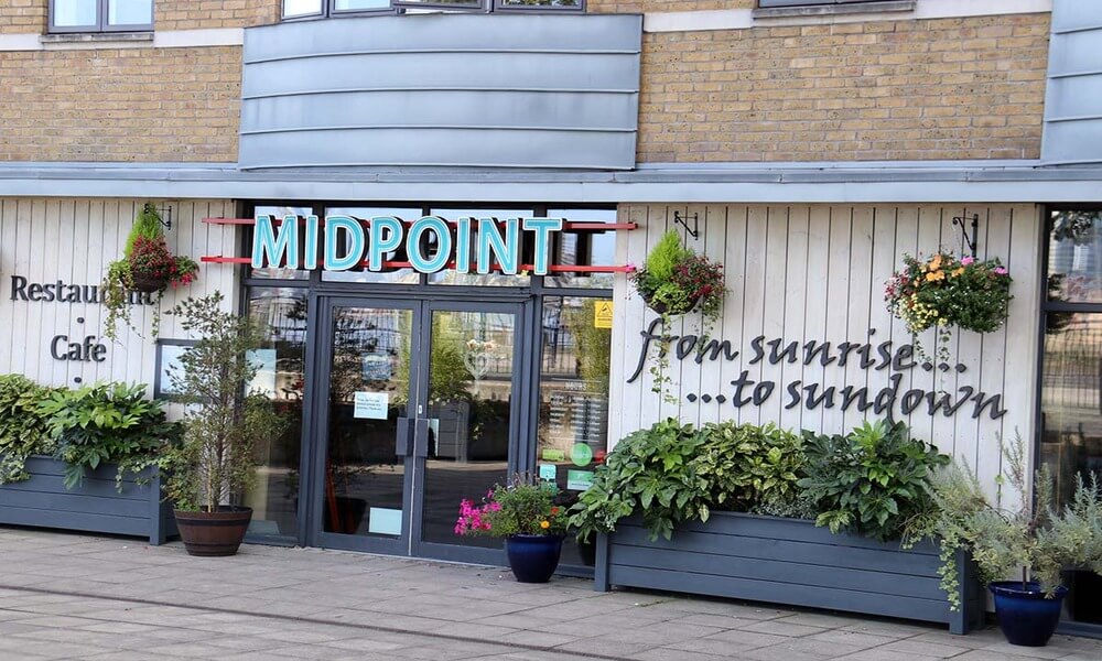 A restaurant with a sign that says midpoint.
