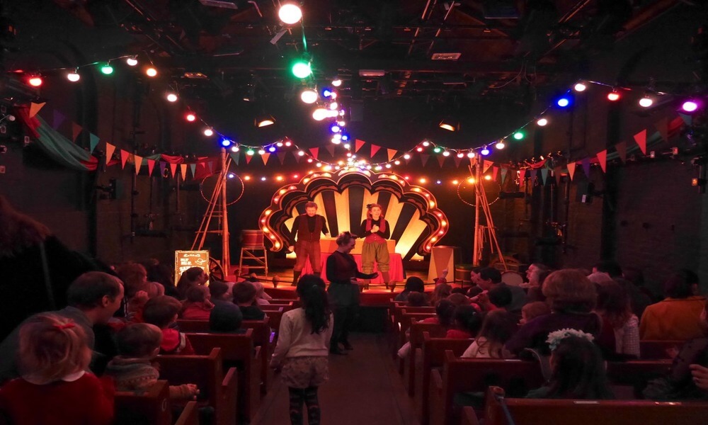 A children's circus performance in a church.