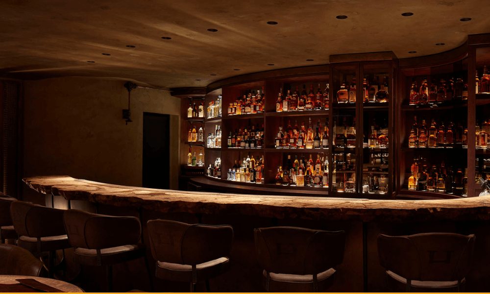 A bar with a lot of bottles.