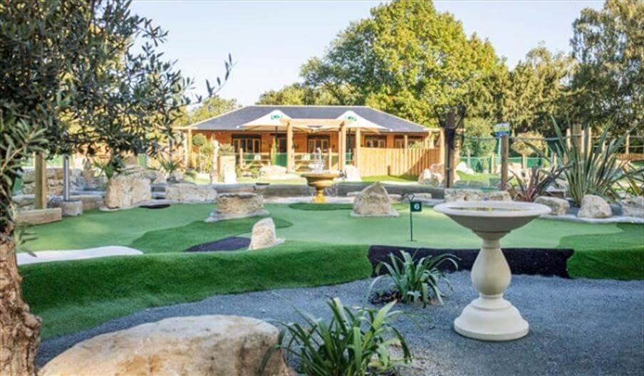 A miniature golf course in a garden.