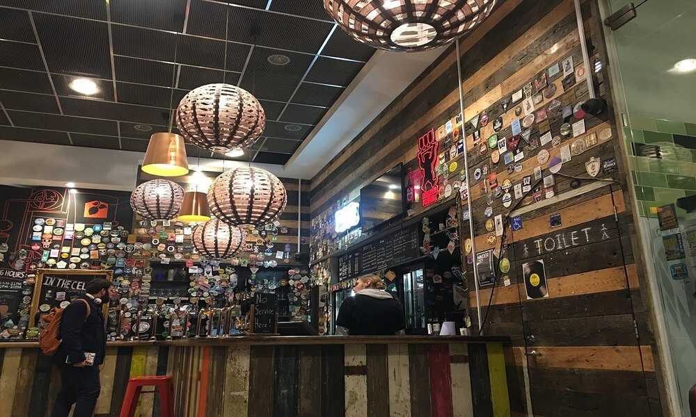 The inside of a bar with a lot of different items on the wall.
