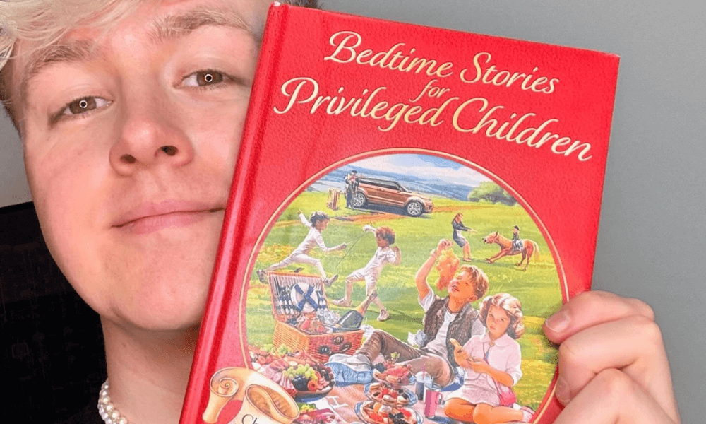 Person holding a book titled "bedtime stories for privileged children.